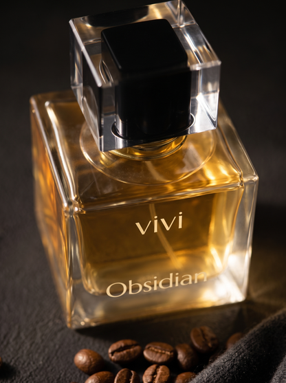 Obsidian bottle detail — glowing champagne juice close-up